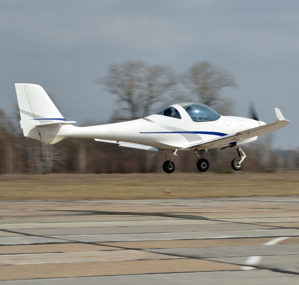 Sport airplane taking off from runway